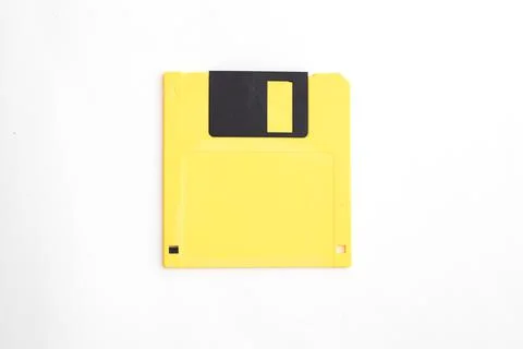 Yellow floppy disk on white background Stock Photos