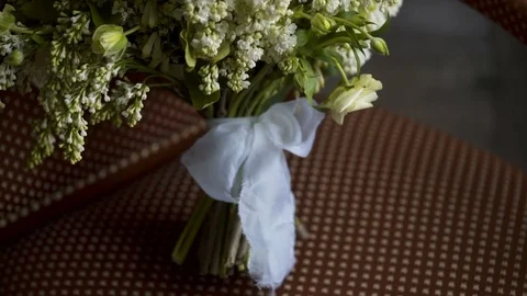 Yellow flowers on chair Stock Footage 76101404