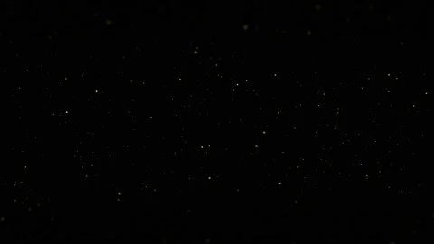 Yellow flying particles on a black background. Animation Stock Footage 226998241