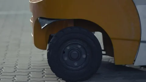Yellow Forklift Wheel And Solid Rubber Tyre Close Up, Paved Yard, Sunny Day 動画素材 341304147