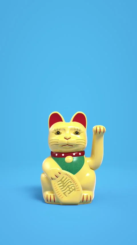 Yellow fortune cat waves paw on blue background. Vídeo Stock 267842871