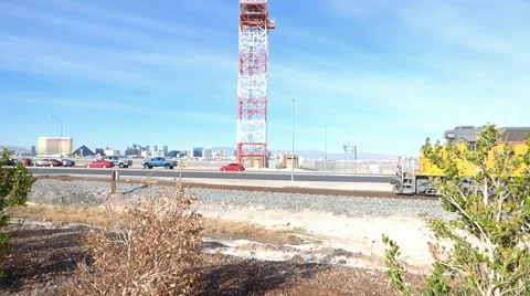 Yellow Freight Train Red and White Metal Tower Video stock 48964936