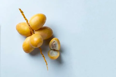 Yellow fresh dates fruit isolate on white background Stock Photos
