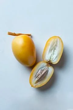 Yellow fresh dates fruit isolate on white background Stock Photos
