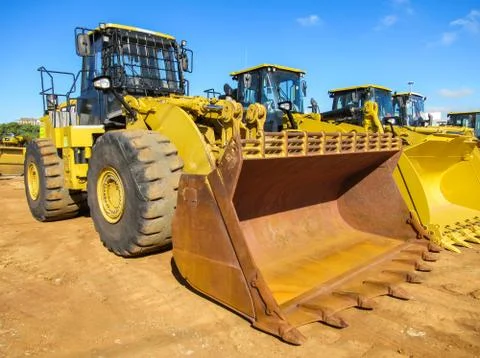 Yellow Front End Loader with rusted load bucket Stock Photos