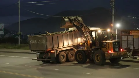 Yellow Front loader remove construction debris Stock Footage 170294053