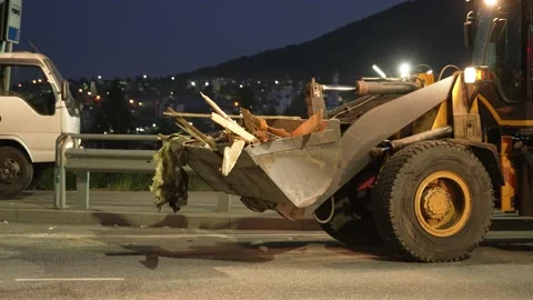 Yellow Front loader remove construction debris Stock Footage 170294086