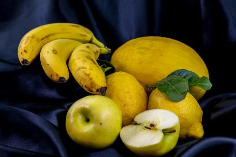 Yellow fruit on a black background Foto stock