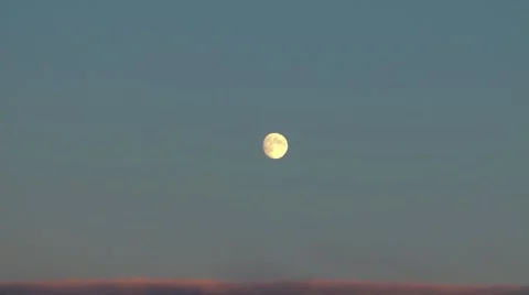 The yellow full moon over edge of continuous overcast, zoom in Stock-Footage 10683383