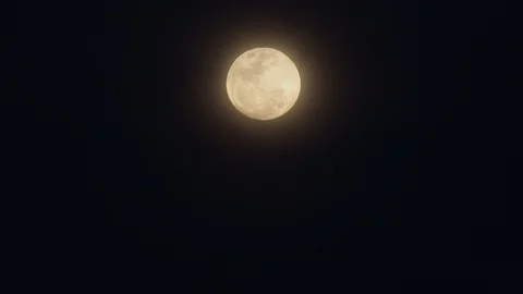 Yellow full moon over very dark background Stock Footage 85500585