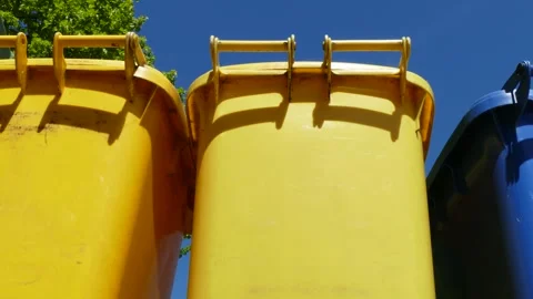 Yellow garbage can for plastic waste from the frog perspective, waste separ.. Video stock 246726354