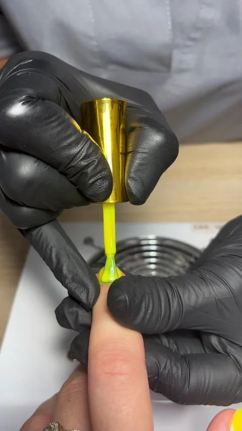 Yellow gel polish coating Stock Footage 303424438