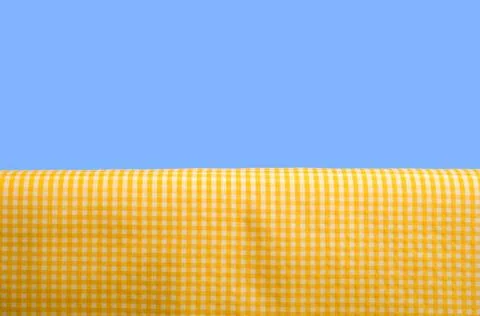 Yellow gingham tablecloth Stock Photos