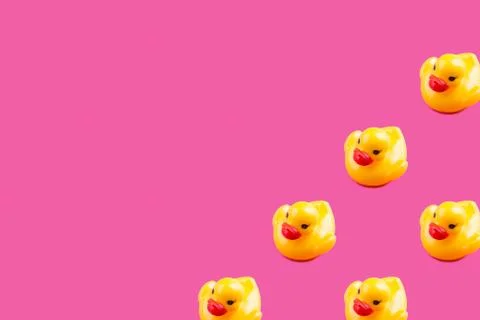 Yellow glamour rubber ducks pattern on pink Stock Photos