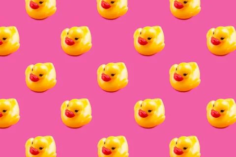 Yellow glamour rubber ducks pattern on pink Stock Photos