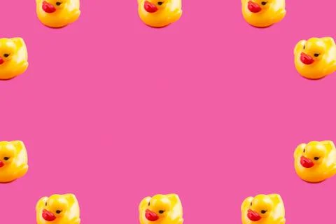 Yellow glamour rubber ducks pattern on pink Stock Photos