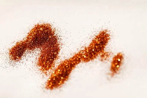 Yellow glitter on light background - macro photo Stock Photos