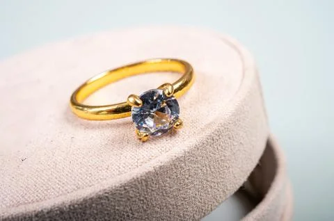Yellow golden ring with large diamond on gift box, engagement ring Stock Photos