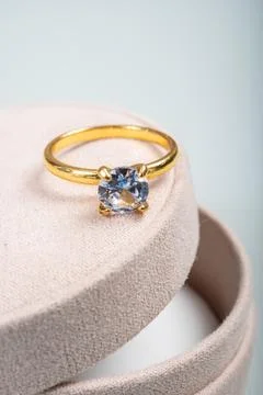 Yellow golden ring with large diamond on gift box, engagement ring Stock Photos