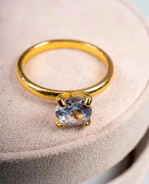 Yellow golden ring with large diamond on gift box, engagement ring Stock Photos