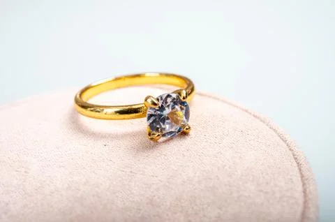 Yellow golden ring with large diamond on gift box, engagement ring Stock Photos