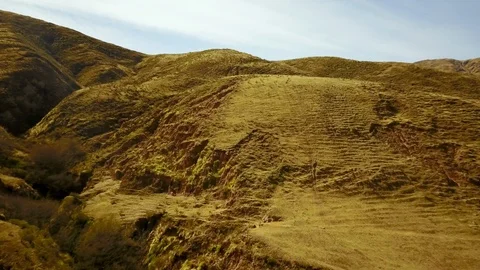 Yellow grass Mountain formations and canyons, Ascending drone shot Stock Footage 89855852
