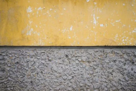Yellow-gray stone texture. Divides in half. Stones and concrete Stock Photos