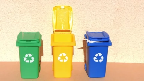 Yellow, green, blue container trash bins for recycling plastic, paper and glass Stock-Footage 264148408