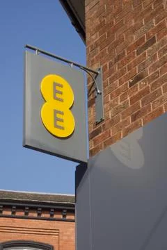 Yellow on Grey EE sign Stock Photos