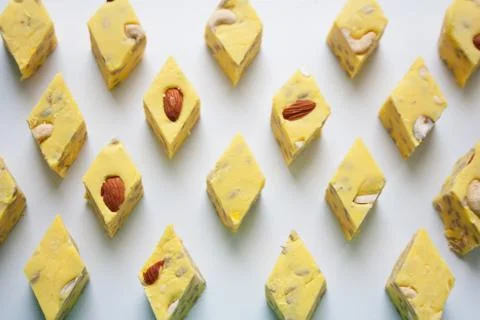 Yellow halva slices rhombus pattern Stock Photos