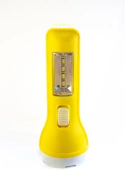 Yellow hand flashlight isolated on white Stock Photos
