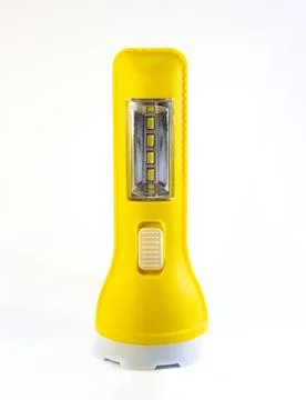 Yellow hand, pocket flashlight isolated on white Stock Photos