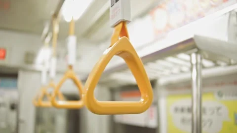 Yellow handle inside a subway train in Japan. Stock Footage 234159986