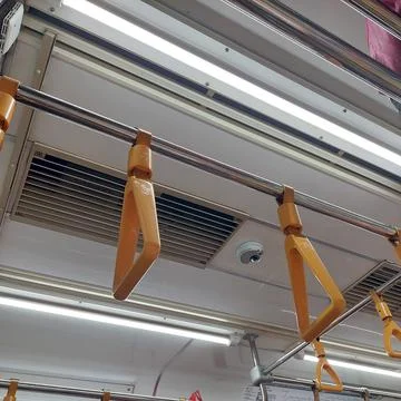 Yellow handrails on the train Stock Photos