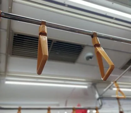 Yellow handrails on the train Stock Photos