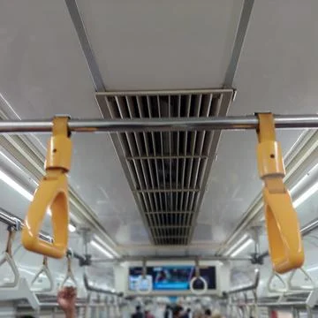 Yellow handrails on the train Stock Photos