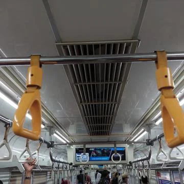 Yellow handrails on the train Stock Photos