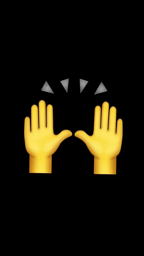 Yellow hands clapping against black background creating dynamic visual Video stock 329406350
