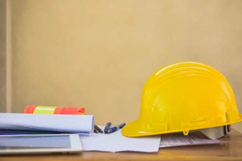 Yellow hard hat for Engineer Foreman Supervisor at construction site is on of Stock Photos