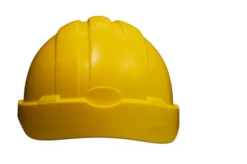 Yellow hard hat promoting workplace safety on white background Stock Photos