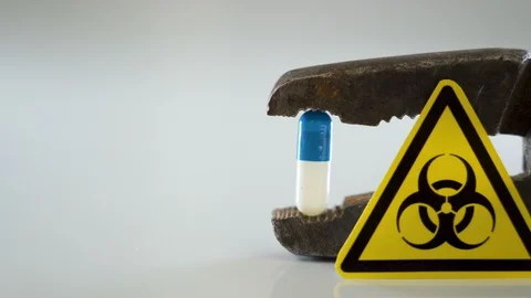 A yellow hazard sign with the pliers on the back Stock Footage 129452690