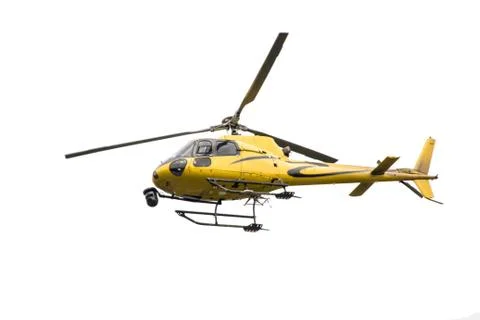 Yellow Helicopter with a camera in flight Stock Photos