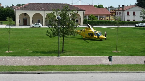 Yellow helicopter starts the engine Stock Footage 130909860