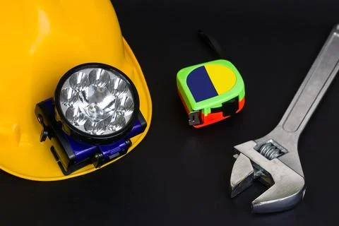 Yellow Helmetwith work tools Stock-Fotos
