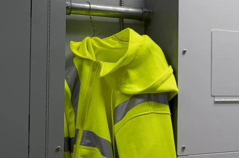 Yellow high vis jacket hanging Stock Photos