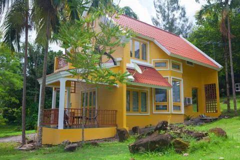 Yellow  house in forest Stock Photos