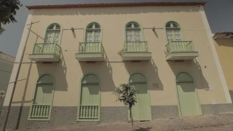 Yellow house with green windows 스톡 동영상 150871069