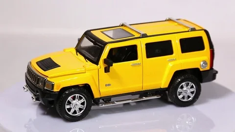 Yellow Hummer H3 scale model SUV car with rotating isolated on white background. Stock-Footage 101774014