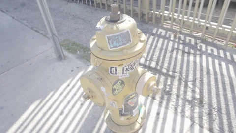 Yellow Hydrant With Stickers Stock Footage 104506402