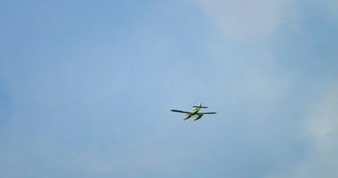A yellow hydro fire extinguisher plane is flying in the sky Stock Footage 344915048